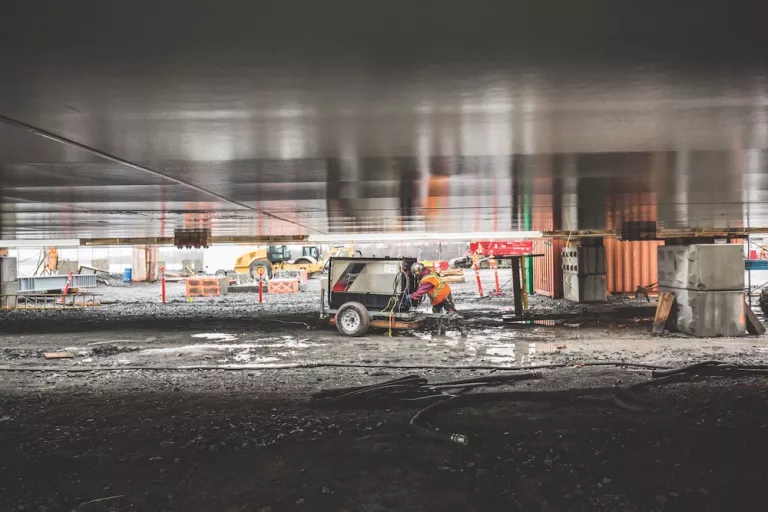 man at generator on worksite