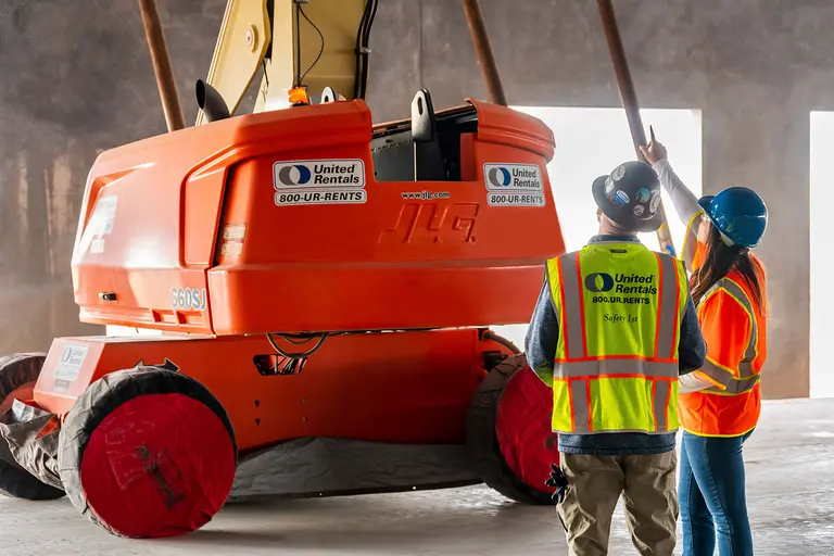 United Rentals employees with a boom lift