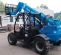 Blue Genie 5,000 lb. telehandler reach forklift parked outside of a building