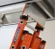 Orange Werner ladder for an Abatement HEPA Dust Containment Cart