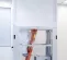 White Abatement HEPA Dust Containment Cart with a worker inside climbing an orange ladder