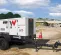 White Wacker-Neuson 20kW towable generator parked at a freeway construction site