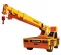 Yellow Broderson 15-ton carry deck crane with boom lowered and facing forward