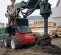 Red Toro 320D Skid steer with screw attachment