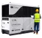 White Generac hydrogen powered fuel cell with a worker standing nearby