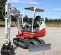 White and red TAKEUCHI 6,000-7,000 lb. Mini Excavator, Reduced Tail Swing