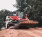 Gray and red TAKEUCHI 2,800-3,400 lb. Compact Track Loader