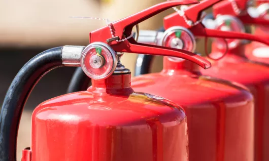 line of fire extinguishers