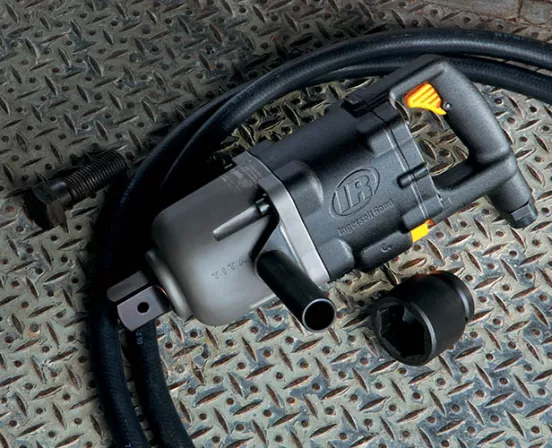 Silver and black Ingersoll Rand 1-1/2 inch drive Air Impact Wrench laying on a metal floor