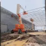 Articulating Boom Lift on Building Site