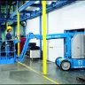 Articulating Boom Lift Extending Horizontally In Construction Space
