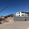 shipping container in front of building construction