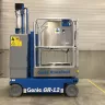 Blue 12 ft. Genie electric powered vertical mast lift in warehouse