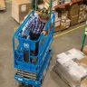Blue Genie 19 ft. electric powered scissor lift in warehouse