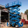 Blue Genie 50-60 ft. 4WD scissor lift extended next to warehouse