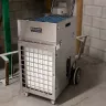 Silver Abatement electric Air Scrubber with 2,400 CFM in the floor of a basement
