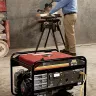 Black Mi-T-M portable inverter generator being used to power a saw