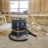 Black Mi-T-M wet/dry portable vacuum sitting in the floor of a construction site
