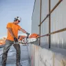 Orange and white Stihl 16 inch cut-off saw cutting through steel rebar