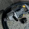 Silver and black Ingersoll Rand 1-1/2 inch drive Air Impact Wrench laying on a metal floor