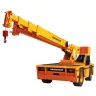 Yellow Broderson 15-ton carry deck crane with boom lowered and facing forward