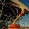 Articulating Boom Lift In Construction Site