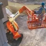 Straight Boom Lift Elevating Construction Worker