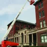 Straight Boom Lift Extending Over Building