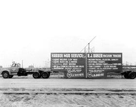 1940's the start Old truck with Baker billboard.
